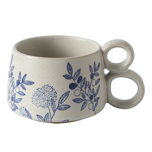 Hand drawn blue and white ceramic office coffee cup